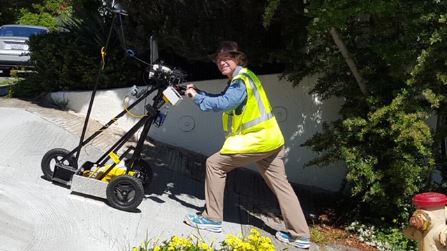 pushing the PROWAP cart up a very steep grade